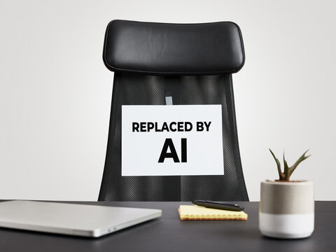 Empty office chair with a replaced by AI sign