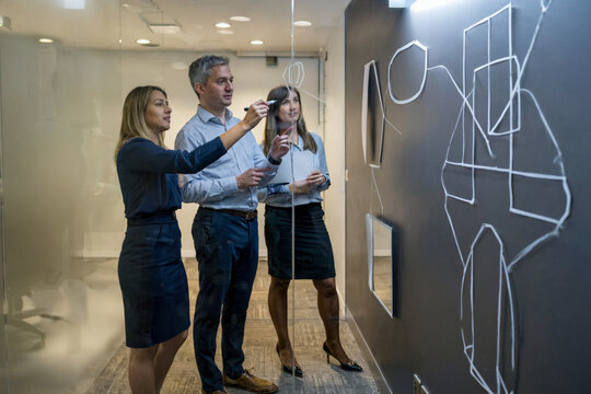 Professional Team Collaborating on Strategy in a Modern Office