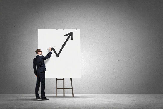 Business Professional Drawing Upward Growth Arrow on Canvas