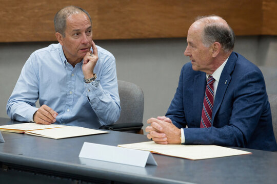 Corporate Executives Discussing Strategy in a Formal Meeting