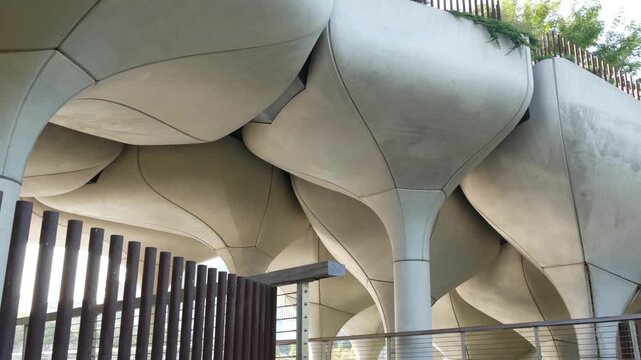 New York City Little Island pier park in Midtown of Manhattan, United States. Urban architecture on pillars in Chelsea, USA. Futuristic contemporary design, river water reflections on concrete columns