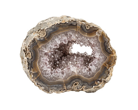 Sliced geode with quartz crystals displays layered mineral formations