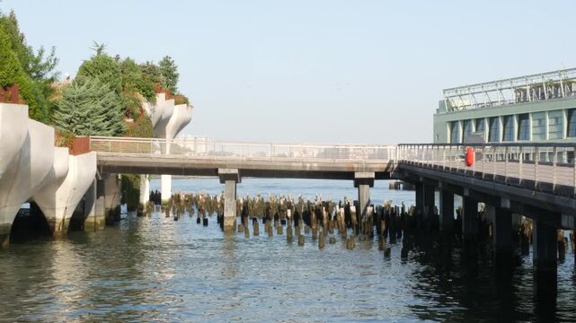 New York City Little Island pier park, oasis in Manhattan Midtown, United States. Urban architecture on pillars in Chelsea, USA. Futuristic contemporary concrete columns design, Hudson river landmark.