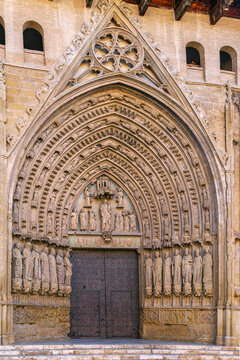 Main portal of Huesca Cathedral, Aragon, Spain, close up view. Sunny daylight, historic Gothic architecture style