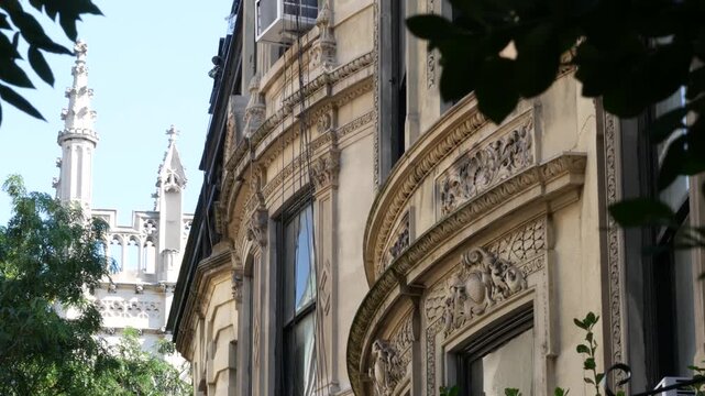 New York City townhouse buildings, brownstone row houses in Manhattan or Brooklyn, United States of America. Classic buildings on residential district street. Real estate property. Rowhouse townhome.