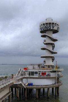 View of the iconic De Pier with its distinctive bungy jump tower and spiral staircase extending over the North Sea in Den Haag, Zuid-Holland, Netherlands.