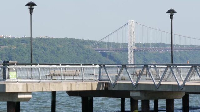 George Washington bridge, Hudson river in New York City, United States of America. Transport bridge architecture, riverside park pier in West Harlem. Waterfront promenade near river water. USA nature.