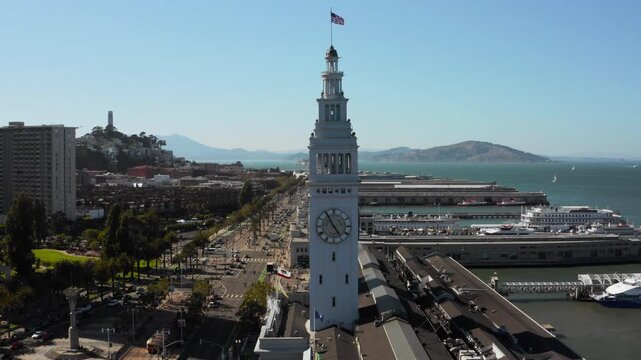 Drone Aerial Passing Over Historic Ferry Building Clock Tower with Alcatraz and Angel Island in the Distance - (UHD 4K)