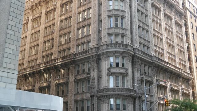 New York City Manhattan Midtown historic building 1909, facade architecture, United States of America. Real estate property on 7 seventh avenue. Classic style design landmark. Corner symmetry, windows