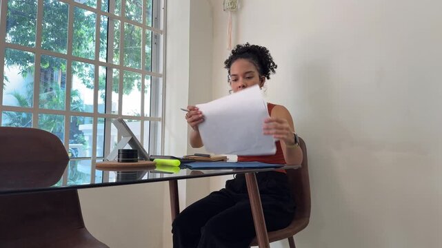 Young businesswoman working remotely from home office