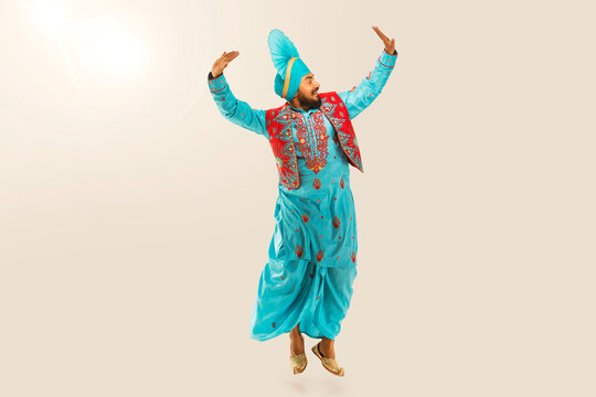 Sikh Man performing bhangra during Baisakhi Celebration