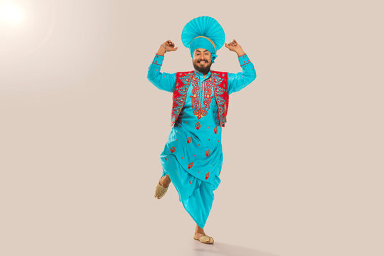 Sikh Man performing bhangra during Baisakhi Celebration