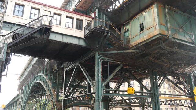 New York City 125 street elevated subway metro metallic bridge in Harlem, United States. American passenger transport, Upper Manhattan. Old outdoor metropolitan station, NYC USA. Historic architecture