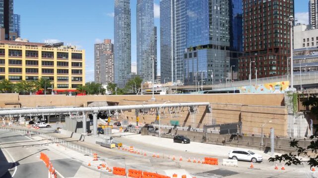 Traffic in Manhattan Midtown, Hells Kitchen New York City, United States of America. Lincoln Tunnel highway junction near Port Authority bus terminal. Toll road transport, cars in residential district