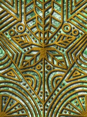 seamless flower pattern with gold ornament on green stone background