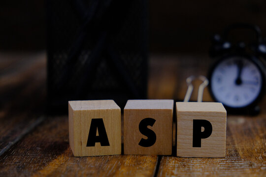 ASP (Application Service Provider) - word on wooden cubes on a background of colored block on a light background. Technology concept