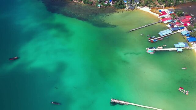 Aerial Coastal View of Sok San Beach With Traditional Wooden Pier and Tropical Resort