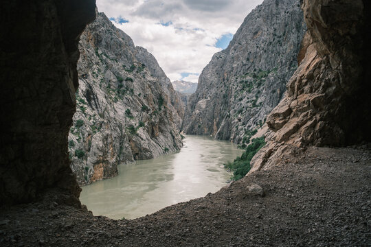 View of the Euphrates River flowing through the steep rocky walls of Karanlik Canyon in Kemaliye, Erzincan, Turkiye.