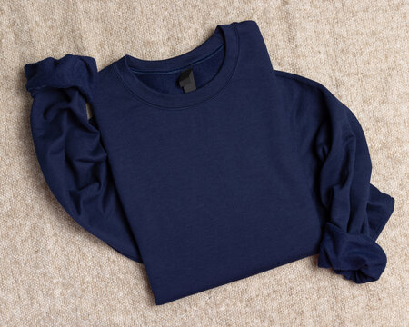 Blank navy blue unisex sweatshirt mockup, folded apparel template with copy space on front