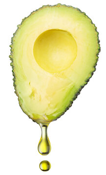  A half of a ripe avocado with a drop of natural oil, isolated on a white background. Essential superfood image.