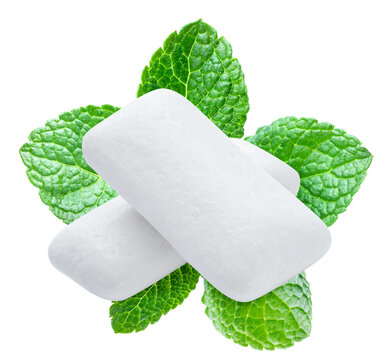 White mint chewing gum pads with fresh green mint leaves for dental care and dental health advertising, with clipping path