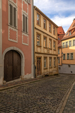 20 August 2026, historic buildings and cobblestone street along Eisgrube lane in the old town of Bamberg, Bavaria, Germany.