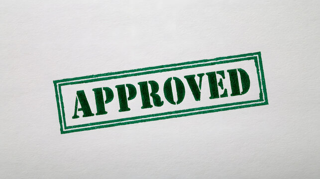 Green approved stamp on white document