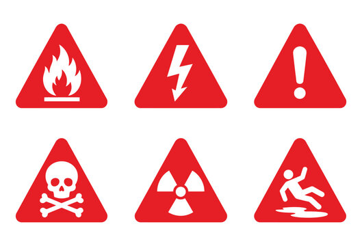 Safety warning triangle set with red emergency symbols for industrial hazard identification.