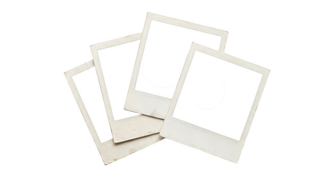 Four blank vintage polaroid photo frames arranged in a stack isolated on transparent background