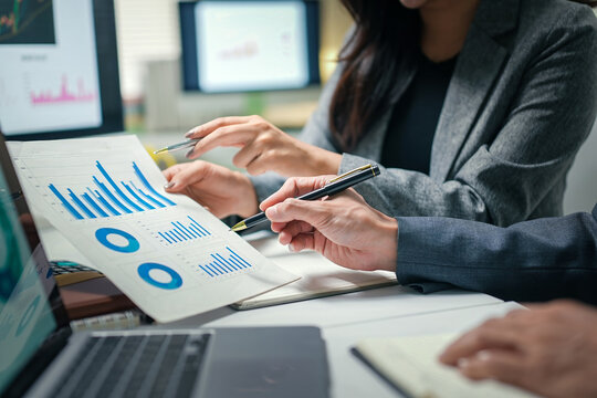 Business Team Analyzing Financial Charts in Meeting