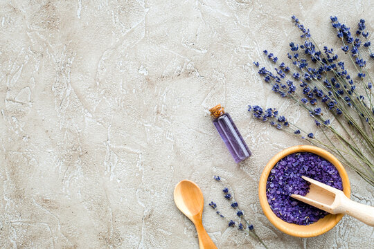 Essential oil and lavender salt with flowers top view
