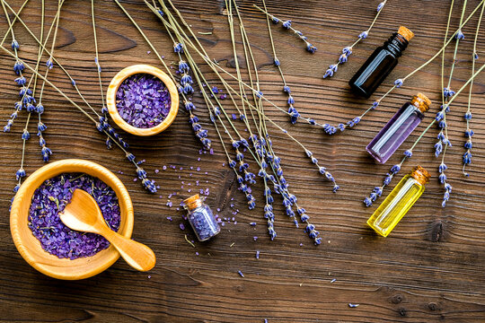 organic cosmetics with lavender on wooden background top view