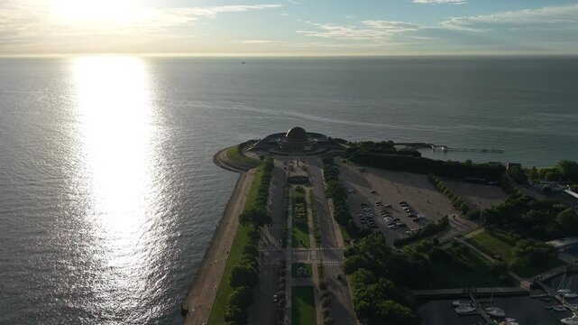 Chicago USA, Drone Shot of Adler Planetarium ald Lake Michigan Horizon on Golden Hour Sunlight 60fps