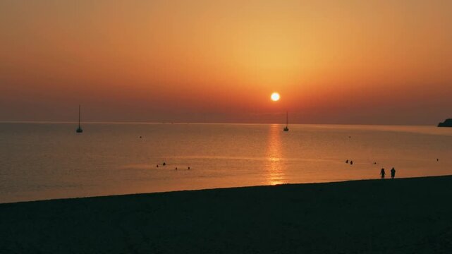 Calm Mediterranean sunset at Cala Mesquida beach, Mallorca