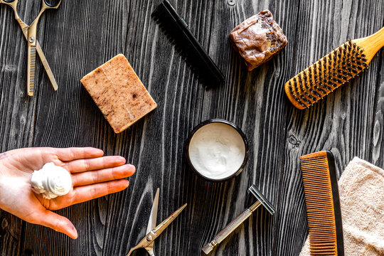 Tools for cutting beard barbershop top view on wooden background