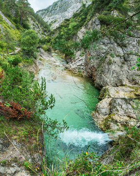 Top down panoramic view of crystal clear turquoise river flowing through Otschergraben (Oetschergraeben) canyon in september, Austria
