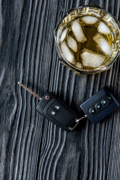 concept of alcohol and driving on wooden background top view