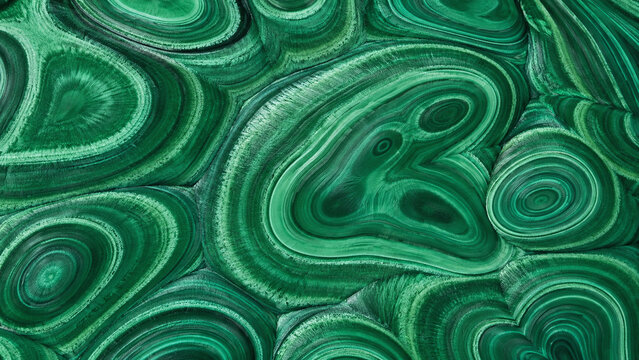 Polished malachite stone surface seamless full frame macro texture concentric green banding emerald forest mint dark green luxury mineral background