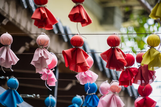 Teru Teru Bozu Charms: Adorable hand-crafted Japanese rain dolls, known as Teru Teru Bozu, are hung in a vibrant display.