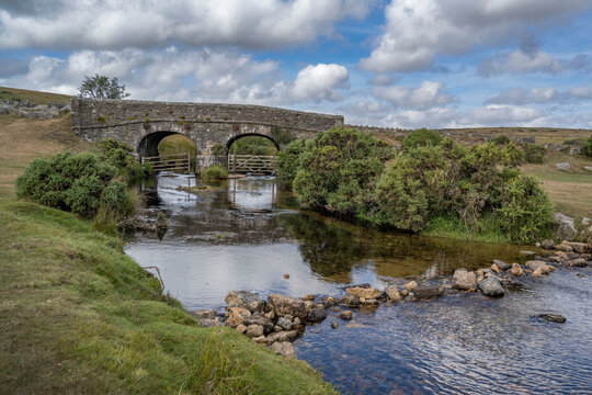 Old stone road bridge across a brook on Dartmoor