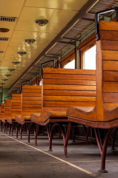 View of vintage wooden train seats inside a historic carriage at the Railway Park in Vilnius, Vilniaus apskritis, Lithuania.