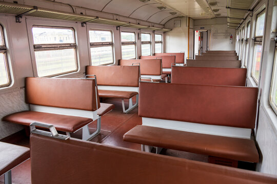 View of the interior of a vintage train carriage with brown leather seats and luggage racks in the Railway Park in Vilnius, Vilniaus apskritis, Lithuania.