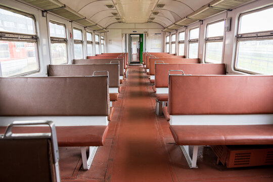 View of the interior of a vintage train carriage with brown leather seats and large windows at the Railway Park in Vilnius, Vilniaus apskritis, Lithuania.
