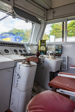 View of the interior of a vintage train locomotive cockpit featuring control panels, gauges, and levers at the Railway Park in Vilnius, Vilniaus apskritis, Lithuania.