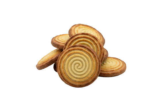 A stack of round golden butter cookies with swirled patterns on isolated on a transparent background