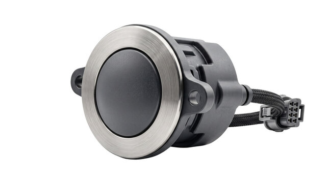 Industrial push button switch with brushed metal bezel, automotive ignition start button, electronic control component on white background
