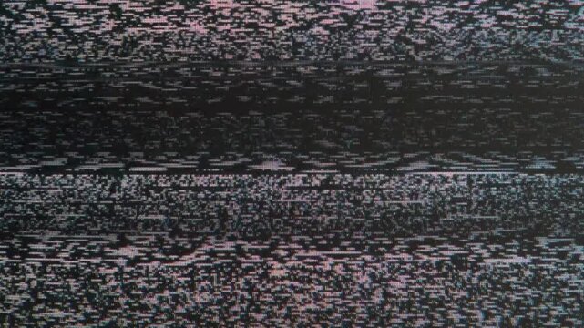 Unstable Radio Signal. Loop. The screen of an old TV, which broadcasts on-air interference inherent in an analog signal - white noise, interlacing, distortion and interference