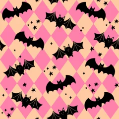 Halloween seamless pattern. Cute bats on a background with pink rhombuses. Repeating vector print for wrapping, textile, decoration. Halloween party. Fall holiday illustration. © EltaMax99