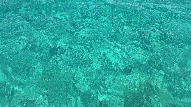 Beautiful turquoise color of the water on the wild beach	on the Ithaca island