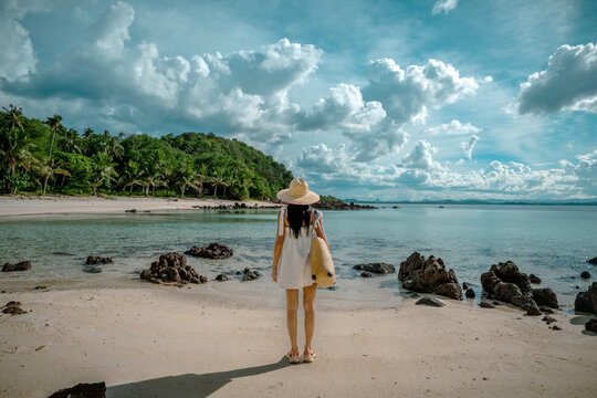 View of sea beach with woman tourist stay enjoy in island of, summer traveling for vacation